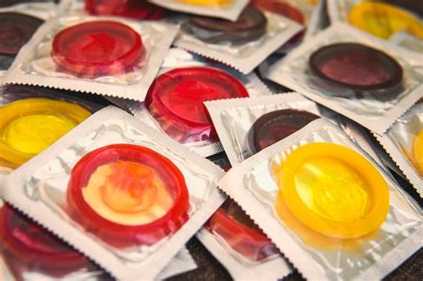 Premium Photo Colorful Condoms On A Background Large Number Of