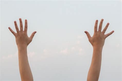 Premium Photo | Hand doing showing number ten gesture symbol on bright ...