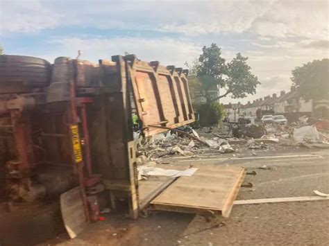 Road Closed After Scrap Metal Lorry Overturns At The Rocket Liverpool