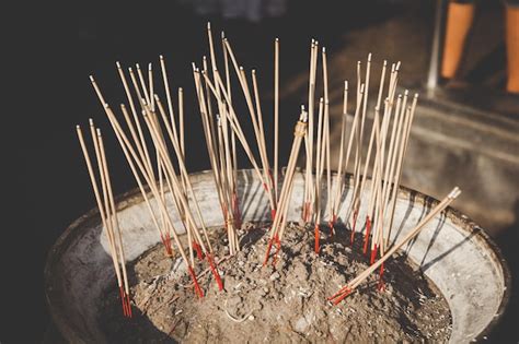 Premium Photo Close Up Of Incense Sticks In Container