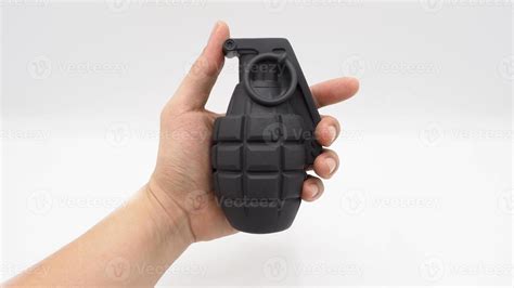 Man hand and military bomb plastic model toy. 12775227 Stock Photo at ...