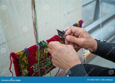 Weaving And Manufacturing Of Handmade Carpets Closeup Women`s Hands