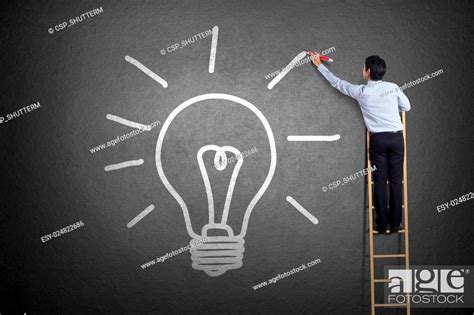 Businessman Drawing Light Bulb Stock Photo Picture And Low Budget