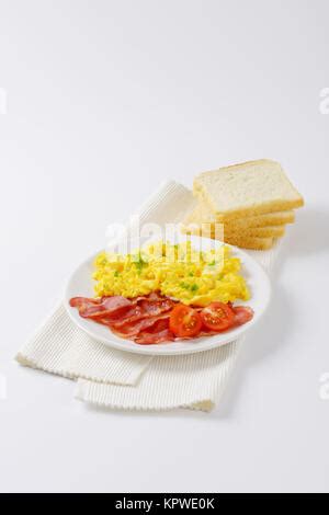 Scrambled Egg With Lean Streaky Bacon Stock Photo Alamy