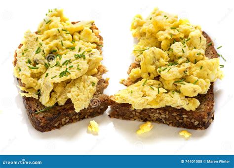 Scrambled Eggs On Rustic Wholemeal Bread Isolated On A White Ba Stock