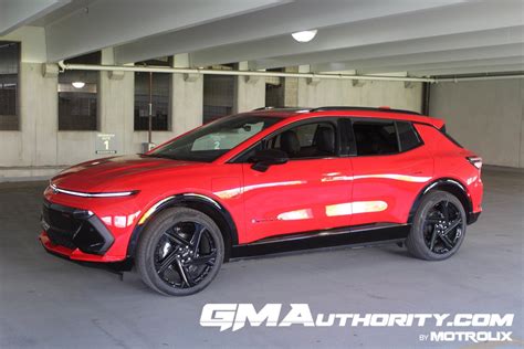 2024 Chevrolet Equinox EV 3RS Red Hot G7C First Drive Exterior 006 Side Front Three