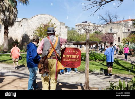 Tourists learning about the Battle of the Alamo at the Living History ...