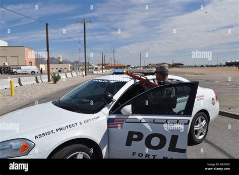 A Military Police Officer Maintains The Perimeter Established At The