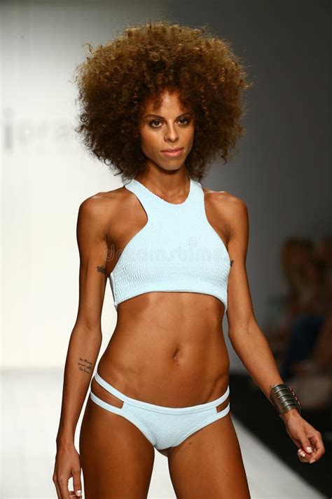 A Model Walks Runway In Designer Swim Apparel During The Tori Praver