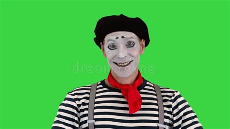 Male Mime Artist Performing Pulling Virtual Rope On A Green Screen