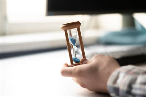 Premium Photo A Businessman Sitting On The Workplace Hand Holding