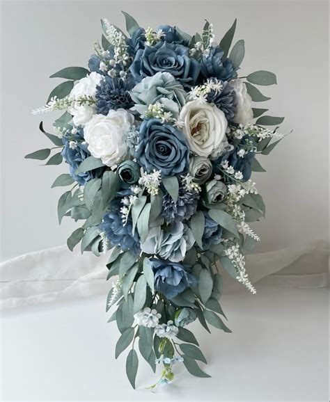 a bridal bouquet with blue and white flowers