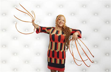 This woman has the longest nails, and she's been growing them for over ...