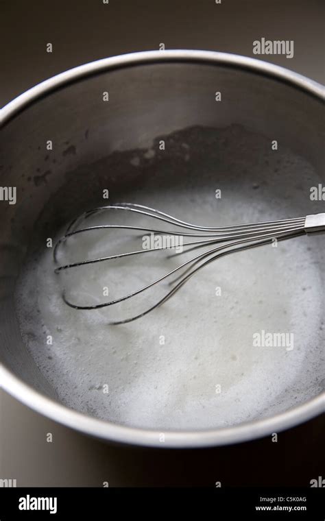 Whisking egg whites Stock Photo - Alamy