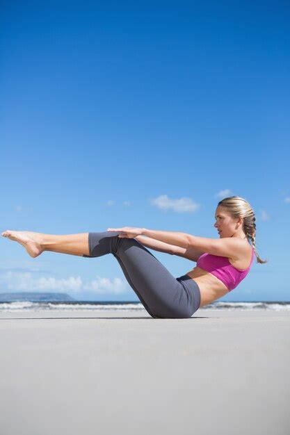 Premium Photo Focused Fit Blonde Doing Yoga On The Beach