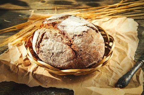 Premium Photo Freshly Baked Traditional Bread On A Wooden Table