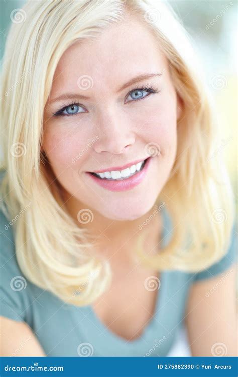 Casual Beauty Cropped Portrait Of A Beautiful Blonde Woman Smiling