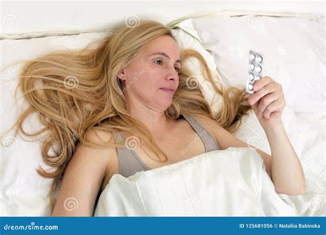 Middle Age Upset Woman Real Portrait Bed Bedroom Blonde Long Hair Fifty