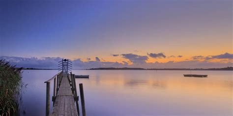 Brown Wooden Dock On Body Of Water Under Cloudy Sky HD Wallpaper