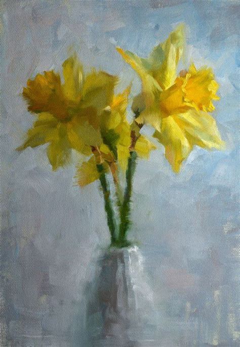 Two Yellow Daffodils In A White Vase On A Blue And Gray Background