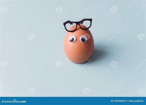 A One Funny Egg with Glasses on Blue Background. Easter Egg Stock Image ...