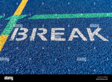 Inspiring Close Up Of The Break Transition On A New Blue Running Track