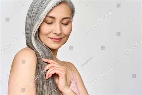 Portrait Of Gorgeous Happy Middle Aged Mature Cheerful Asian Woman