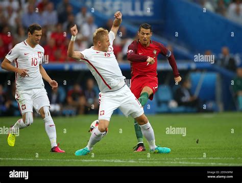 Portugal S Cristiano Ronaldo Tries To Get A Shot Past Poland S Kamil