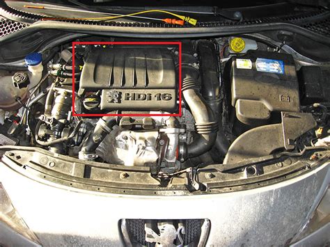 Removing The Decorative Cover Casing Of The Peugeot 207 Engine