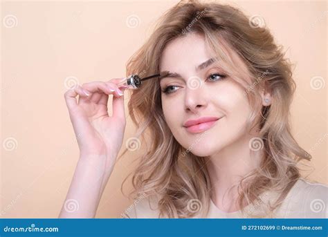 Beautiful Woman Applies Brow Gel With Brows Brush To Her Eyebrow