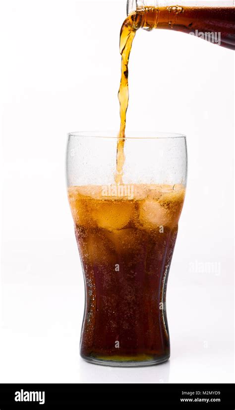 Bottle Pouring Coke In Drink Glass With Ice Cubes Stock Photo Alamy