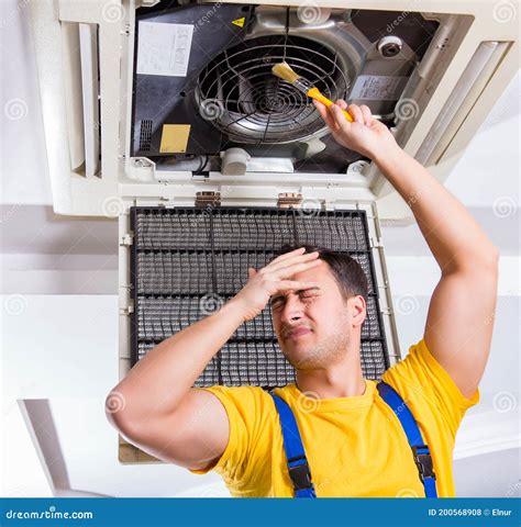 Repairman Repairing Ceiling Air Conditioning Unit Stock Photo Image