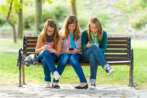 Teen Girls Using Their Mobile Phones Stock Photo Image Of Girl Pupil