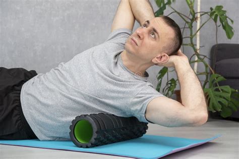 Man Doing Myofascial Release Of Hyper Flexible Muscles Of Back With