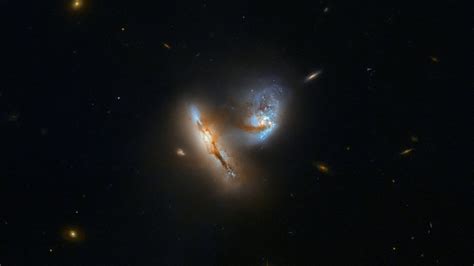 Nasa S Hubble Captures A Pair Of Galaxies Merging Distorting In Spectacular Detail Firstpost