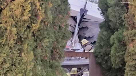 Small Plane Seen Falling From Sky Before Crashing Into House