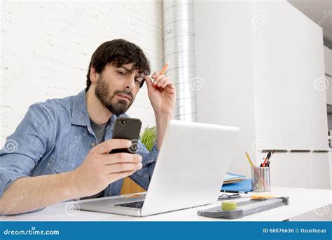 Hispanic Attractive Hipster Businessman Working At Home Office Using