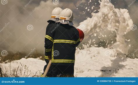 Firemen Extinguishing Fire In Field Stock Photo Image Of Burn Team