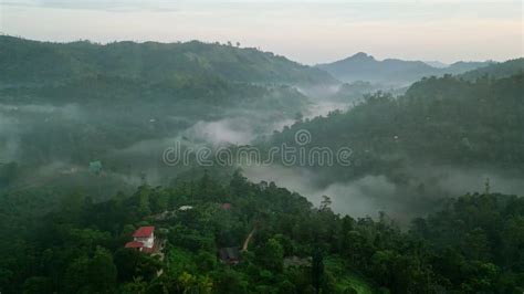 Sunrise Above Misty Ella Mountains In Sri Lanka Early Morning Drone