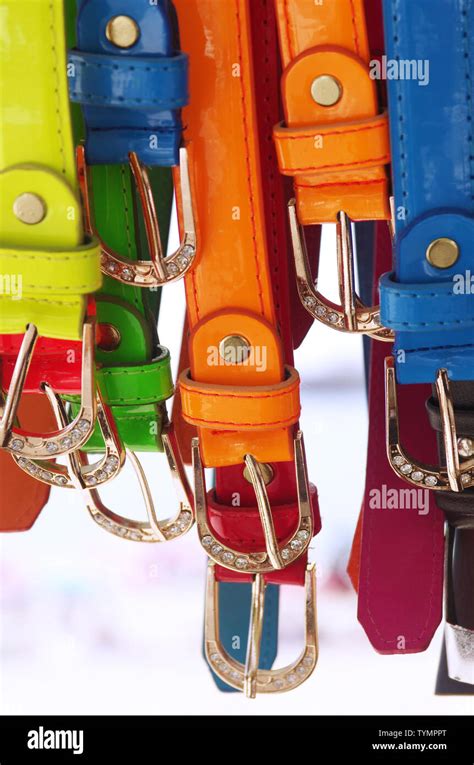 Assorted Colorful Leather Belts With Silver Buckles Hanged For Sale