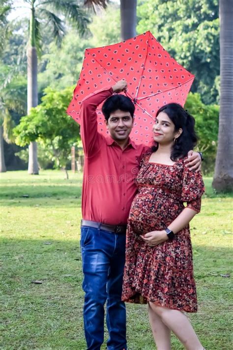 Indian Couple Posing For Maternity Shoot Pose For Welcoming New Born