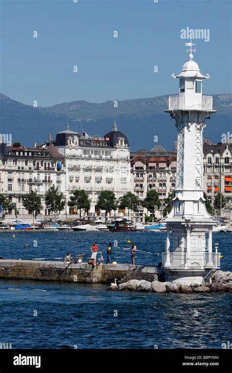 Bathing And Relaxing In Front Of The White Lighthouse Of The Bains Des