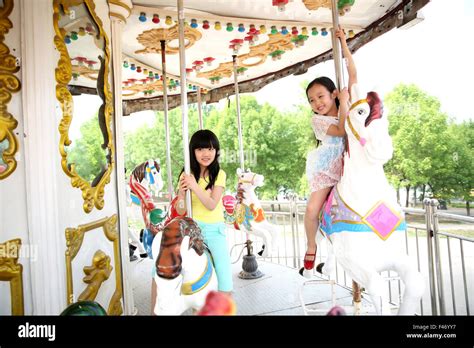 Girls On Carousel Stock Photo Alamy