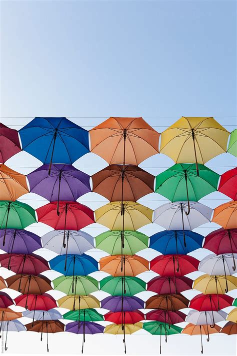 Colorful Umbrellas Hanging Above The Street By Stocksy Contributor