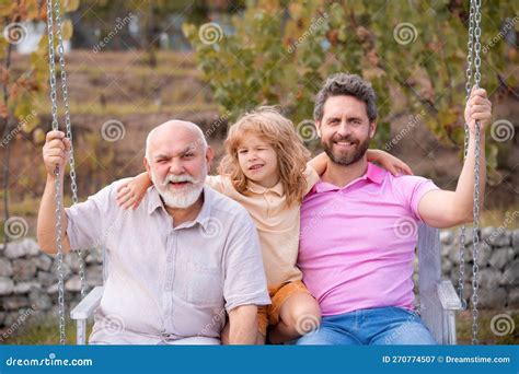 Men Generation Grandfather Father And Grandson Are Hugging Looking At