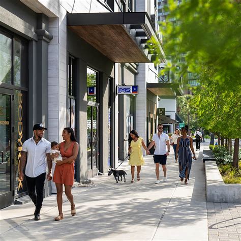 People Walking Down Sidewalk