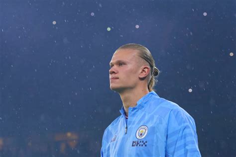 Manchester City's Erling Haaland reacts to his rating on FIFA 23