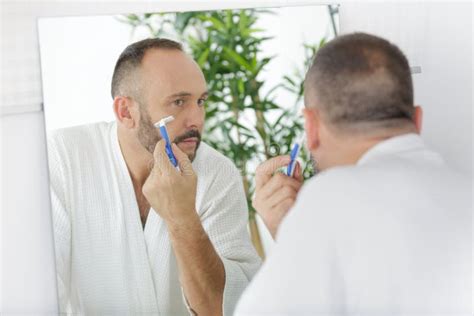 Mature Handsome Man Shaving In Front Mirror Stock Photo Image Of
