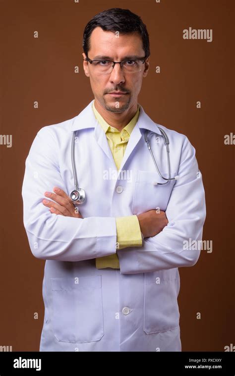 Portrait Of Handsome Man Doctor With Arms Crossed Stock Photo Alamy