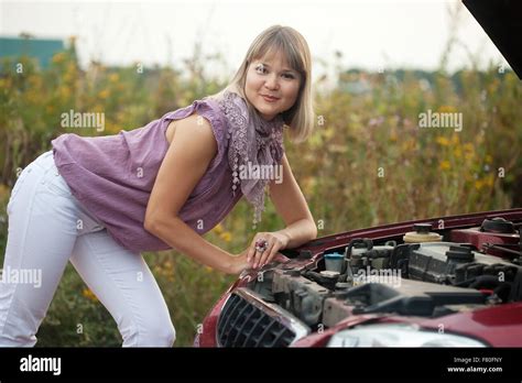 Blonde Woman Trying To Fix The Car Stock Photo Alamy